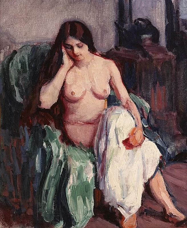 Studio di nudo in poltrona